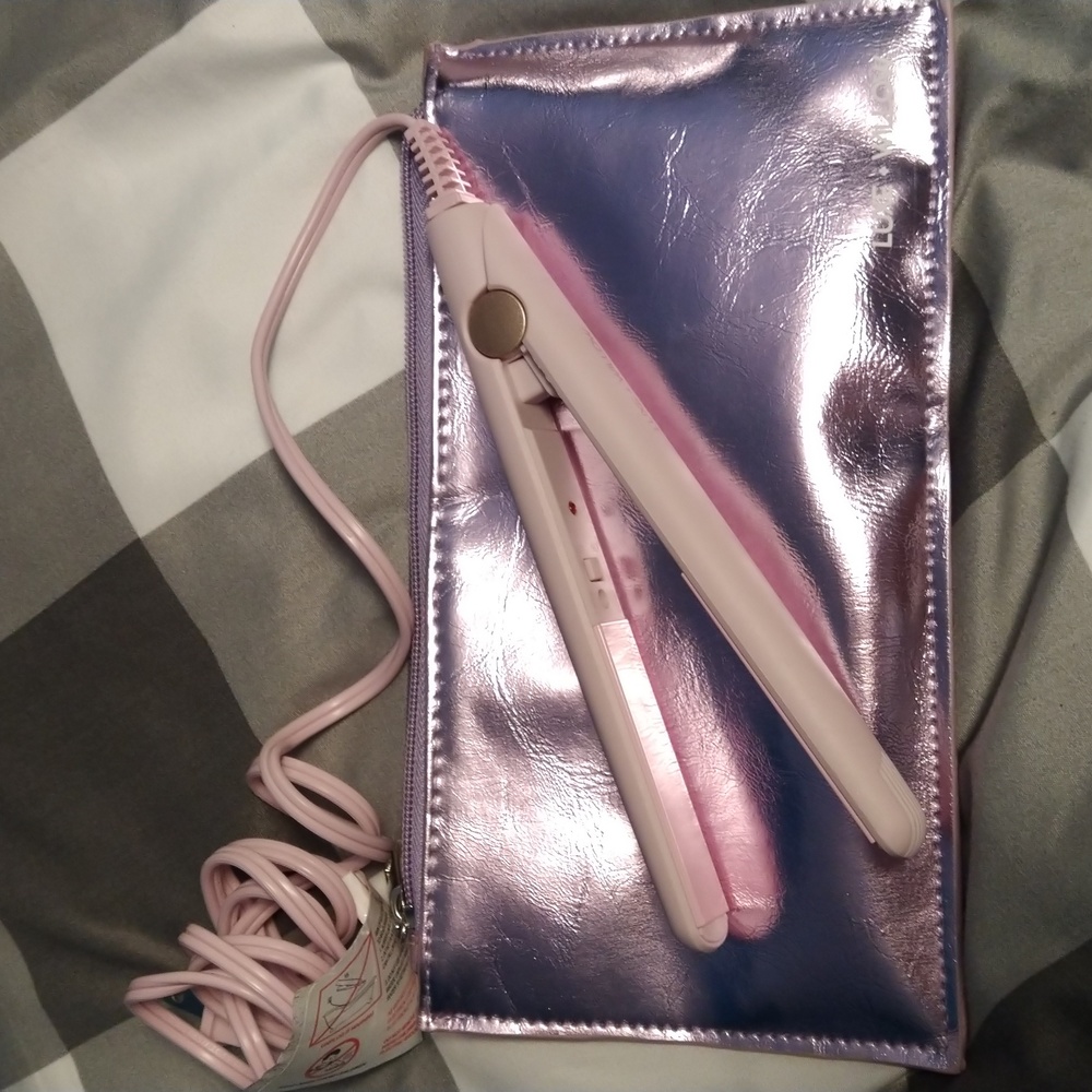 Small travel flat iron, pink/purple with bag.
